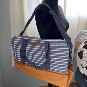 NIP weekender bag with adjustable and removable strap.